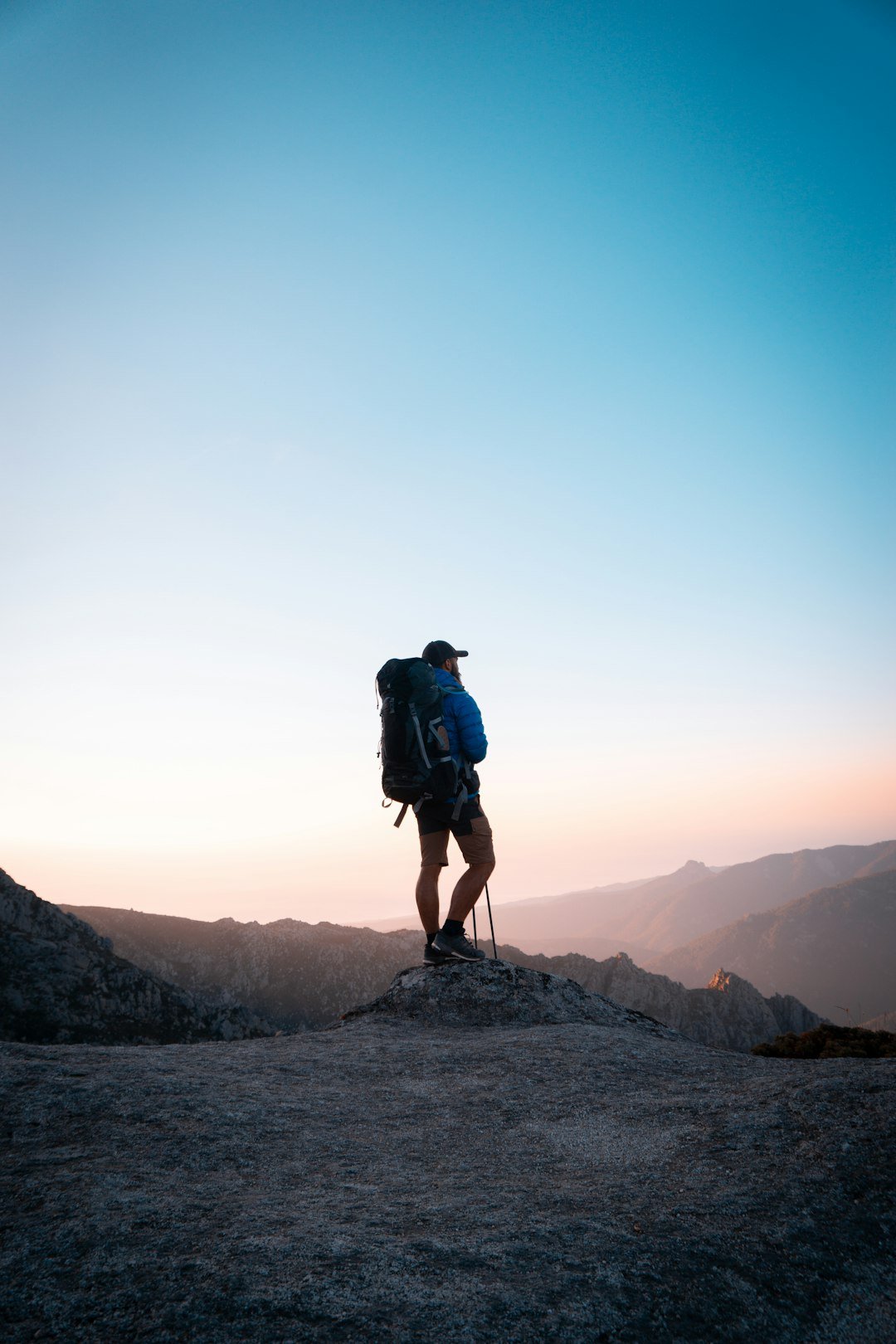 Hiker with backpack on a mountain trail