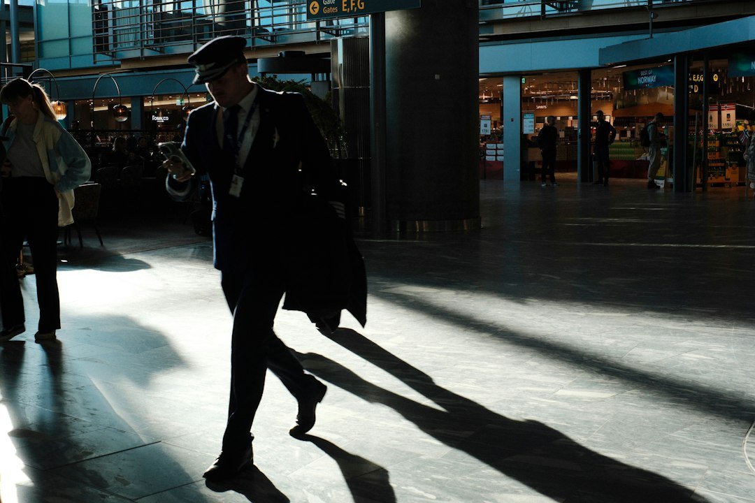 Man walking through an airport terminal